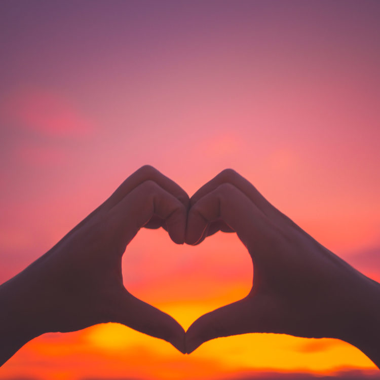 Silhouette Woman Hands To Be Heart Shape On Sunset Background. H Silhouette Woman Hands To Be Heart Shape On Sunset Background. H