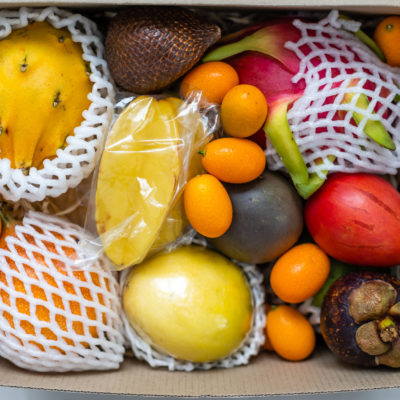 Variety Of Exotic Fruits In A Wooden Crate Variety Of Exotic Fruits In A Wooden Crate